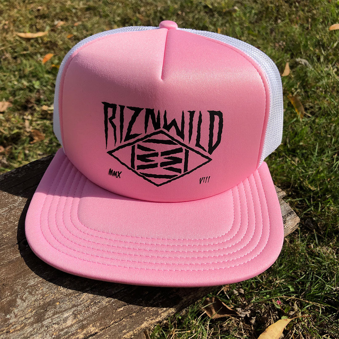 RIZNWILD Creep Trucker Hat in Pink and White with black diamond logo on front panel, flat bill, and mesh back
