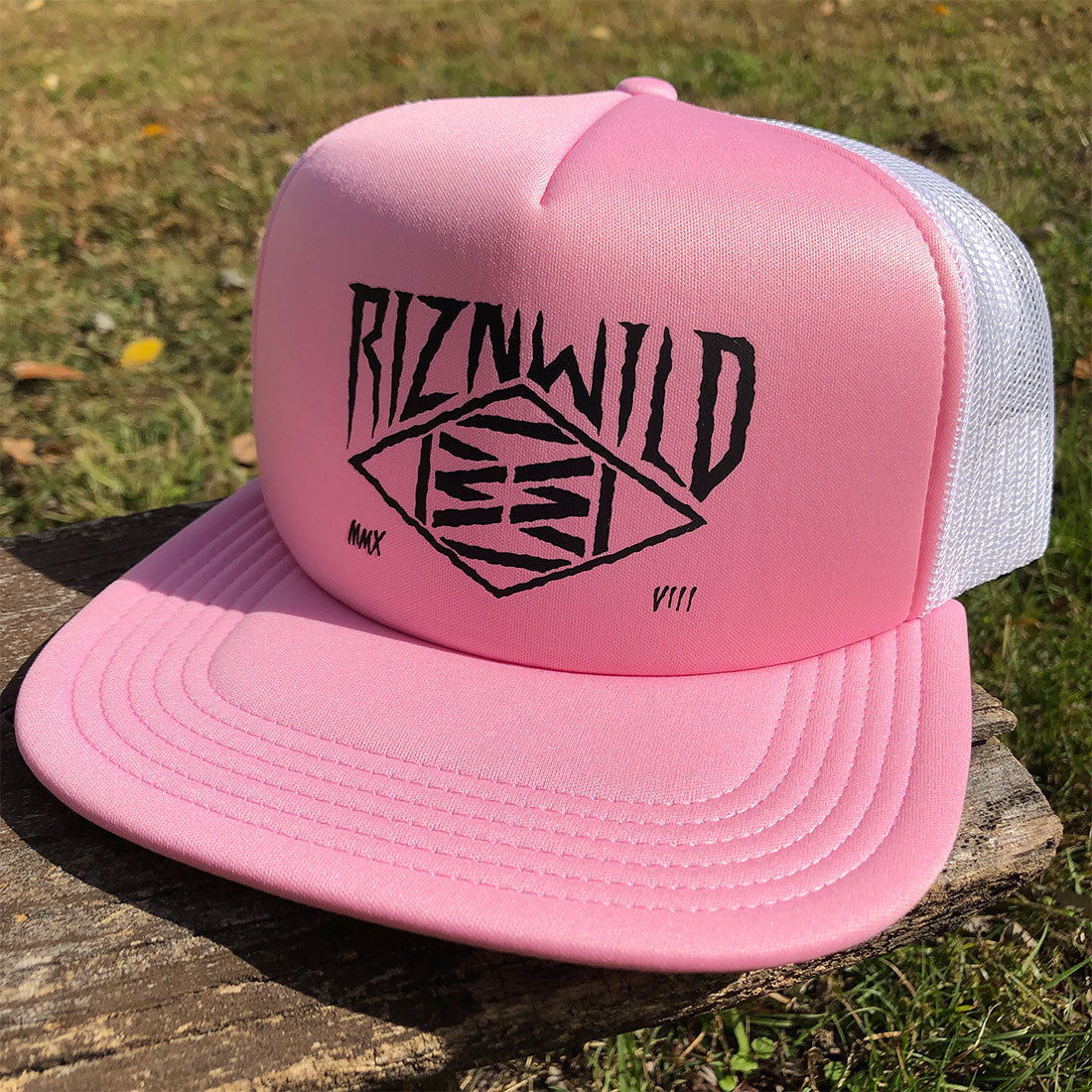 RIZNWILD Creep Trucker Hat in Pink and White with black diamond logo on front panel, flat bill, and mesh back