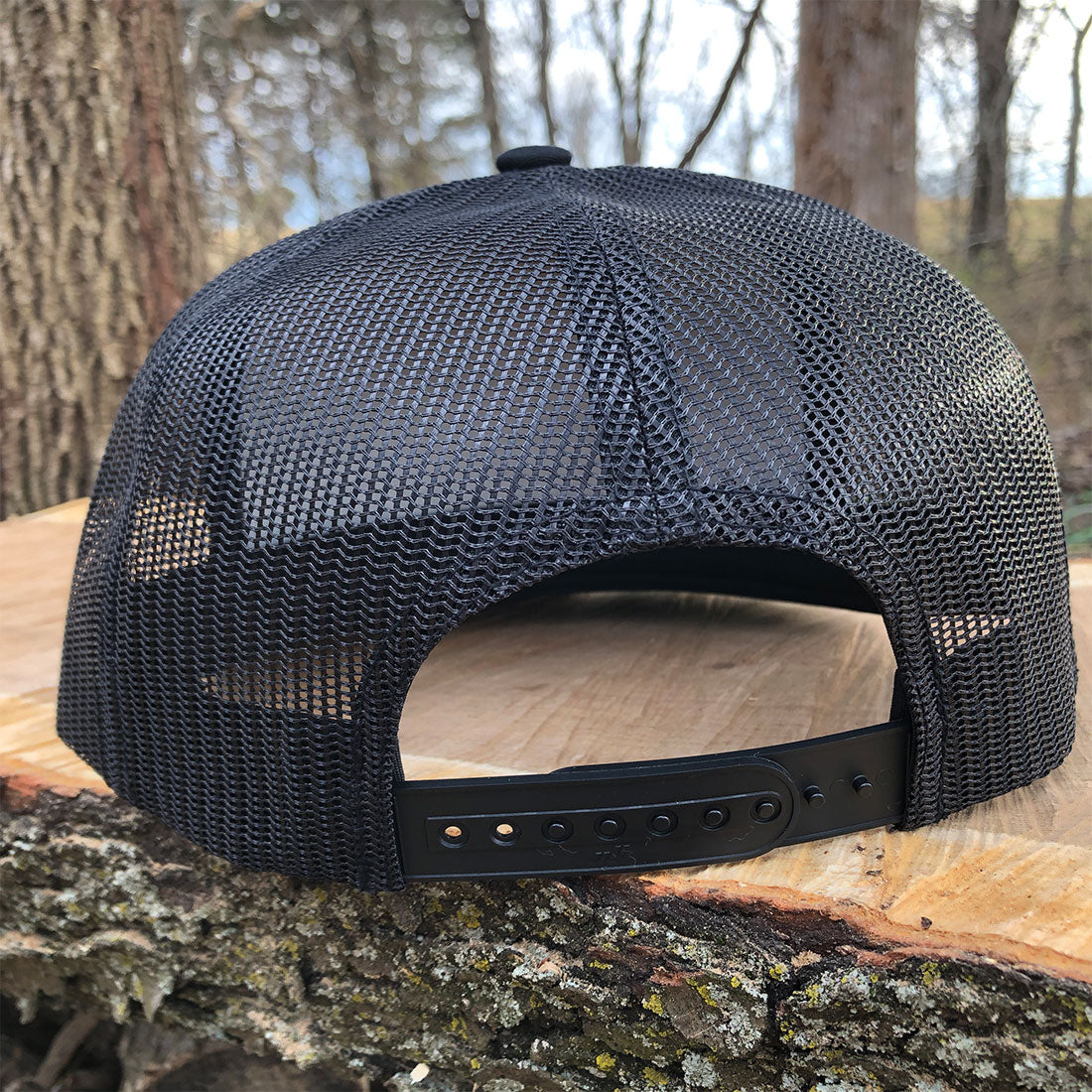 Legend Flat Bill Trucker Hat in Black