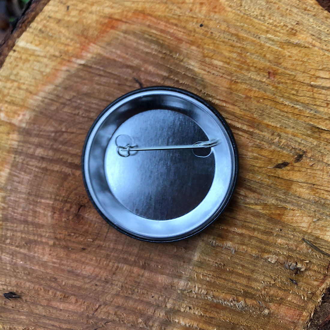 America 250 RIZNWILD button featuring American flag, 1776 emblem back clip view