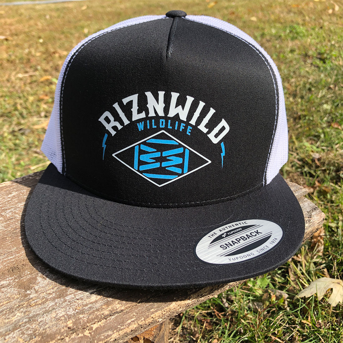 Front view of RIZNWILD Wildlife logo on black snapback hat with white mesh back.