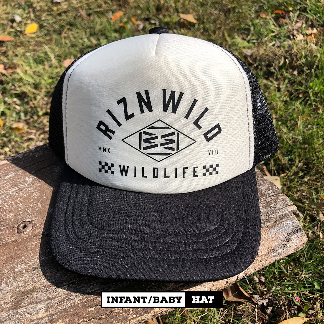 Cream and black infant trucker hat with RIZNWILD Wildlife logo displayed