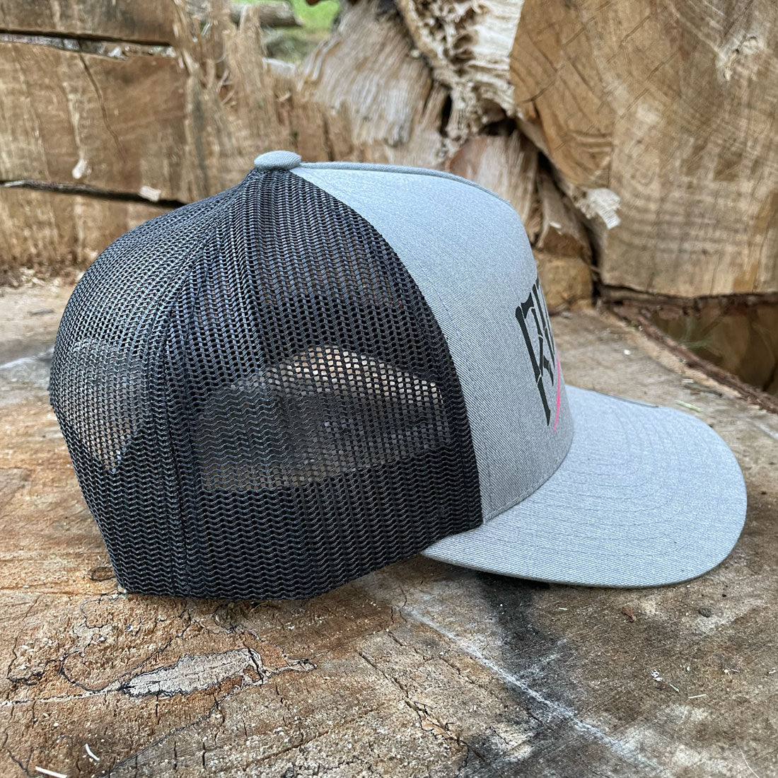 Heather grey trucker hat with black mesh back and RIZNWILD anchor graphic