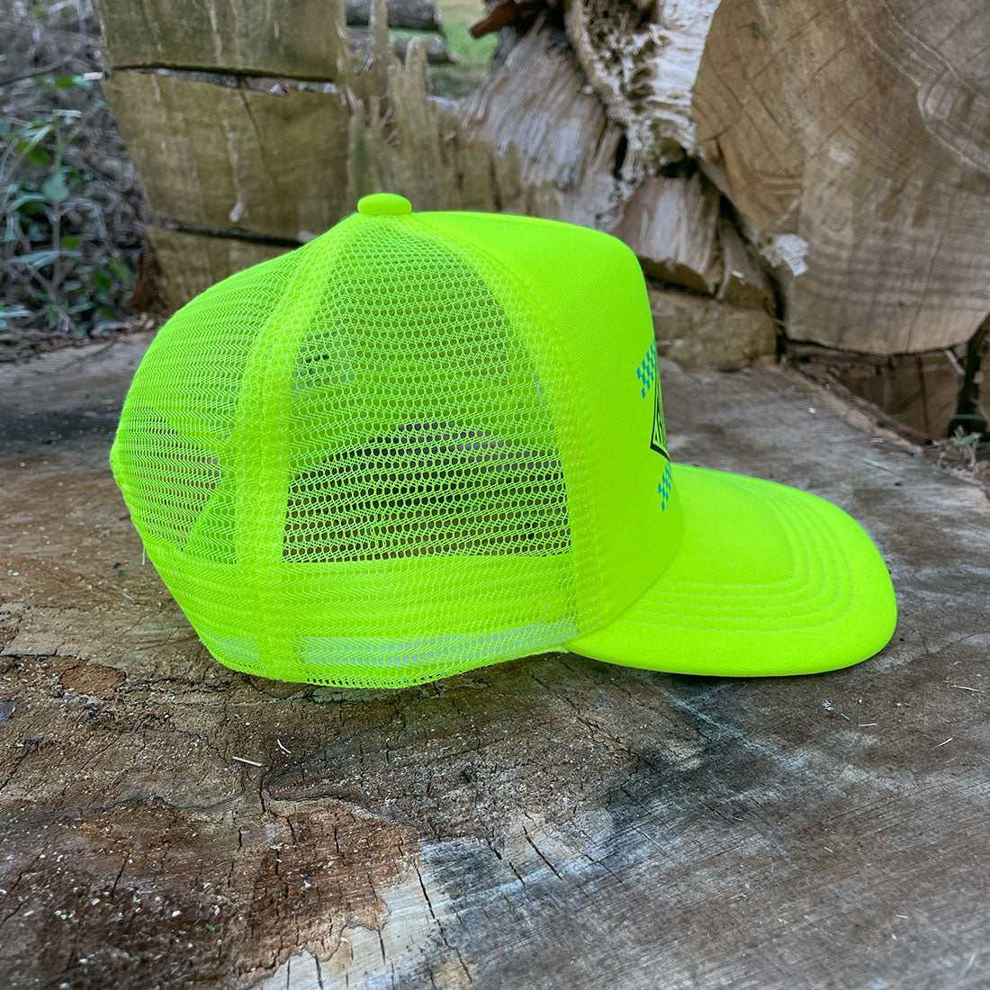 High-visibility yellow hat with blue checkered graphic and curved brim