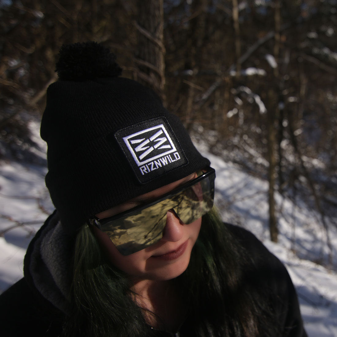 women wearing riznwild beanie in the snow