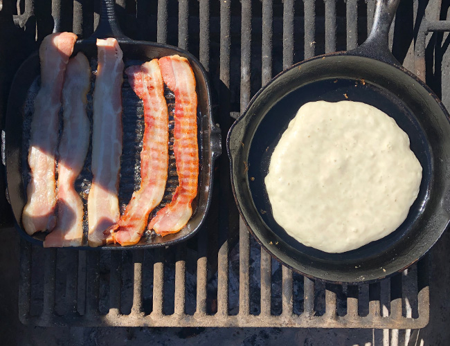 Camping breakfast; skillet cooked pancakes and bacon | RIZNWILD