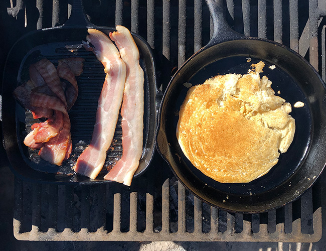 Camping breakfast Ideas; cast iron cooked pancakes and bacon | RIZNWILD
